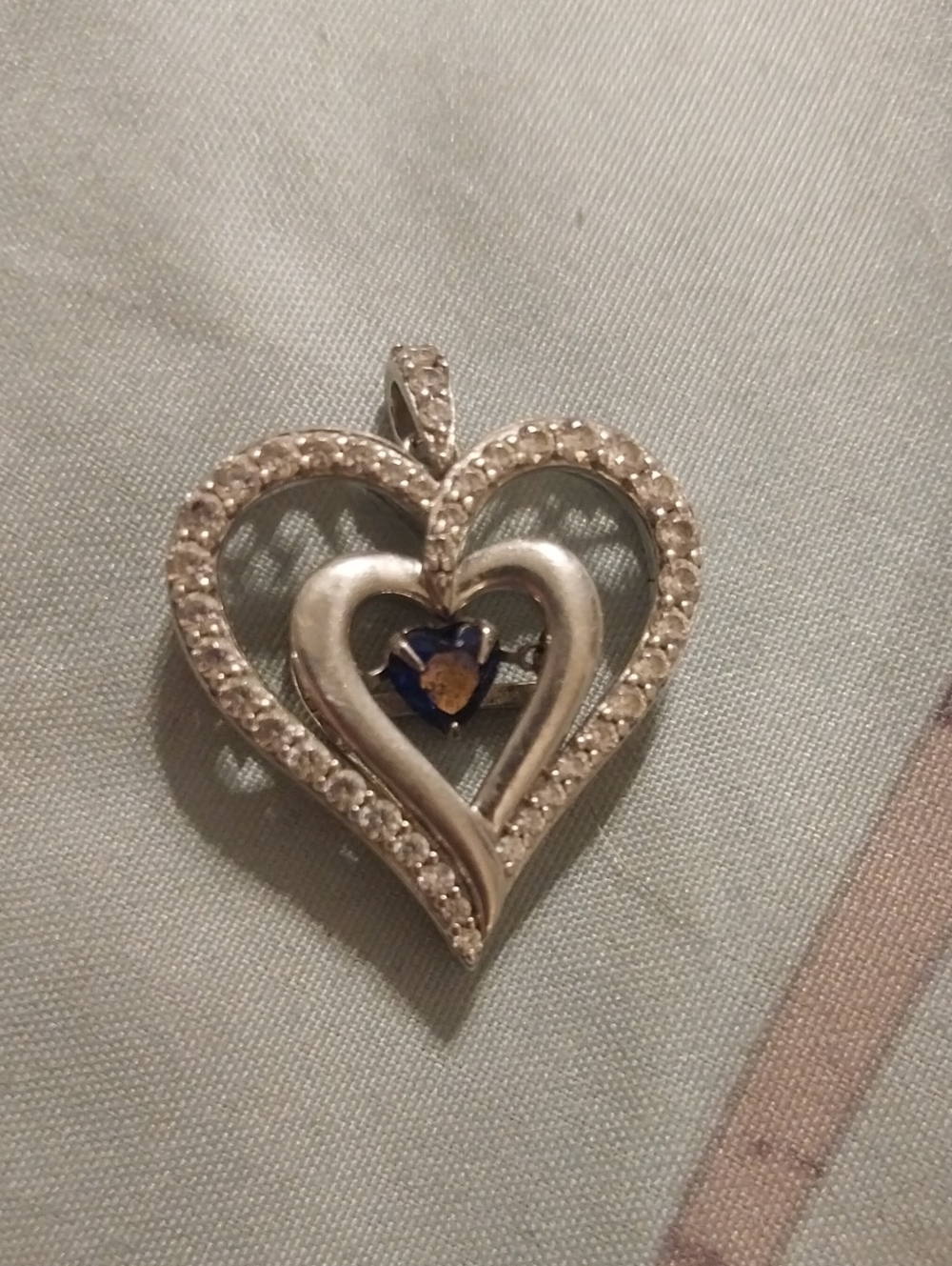 Heart-Shaped Silver Pendant with Blue Sapphire Stone In Middle Infinity Stone